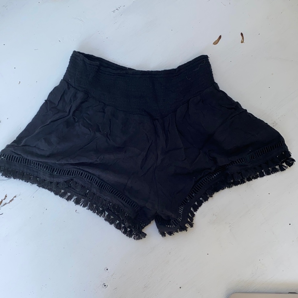 Black flowy shorts with tassels